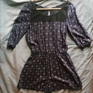 Grey floral romper with lace top section